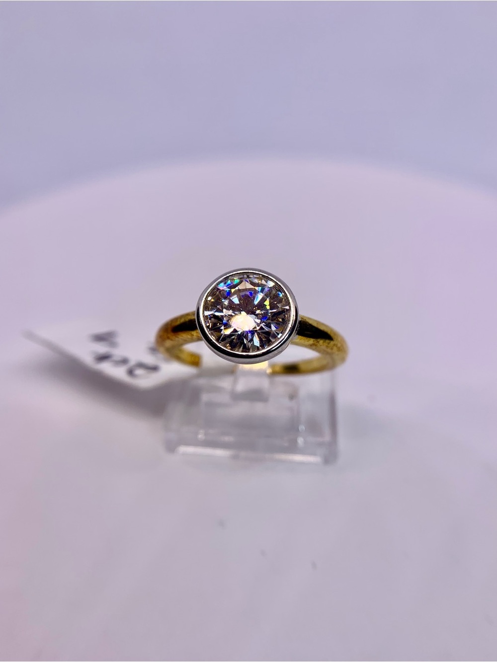 Gold Ring with Round Clear Solitaire Center